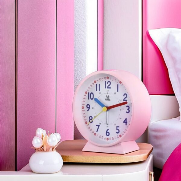 placed on a wooden bedside table in a cozy girl's bedroom