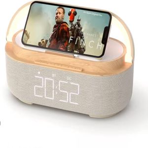Accueil Réveil matin Réveil matin Réveil avec un téléphone posé dessus, écran allumé affichant une affiche de film